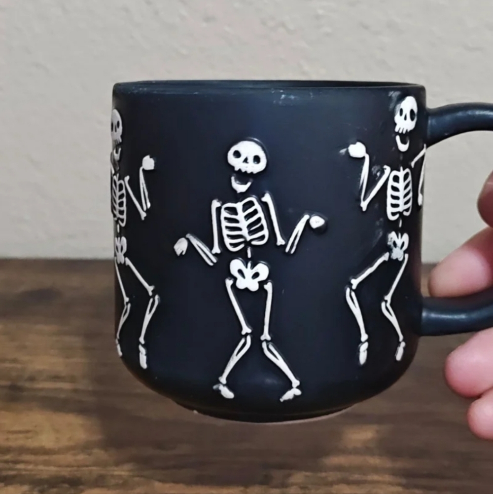 Dancing Skeletons Black Earthenware 13 oz 3D Embossed Black Mug.